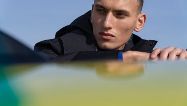 Man next to new PEUGEOT 208