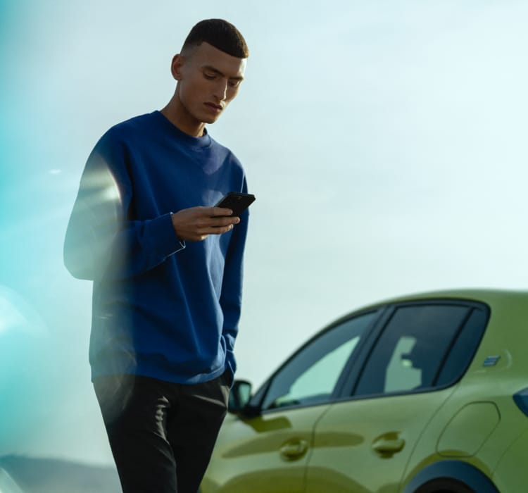 Man next to the new Peugeot 208 Agueda Yellow